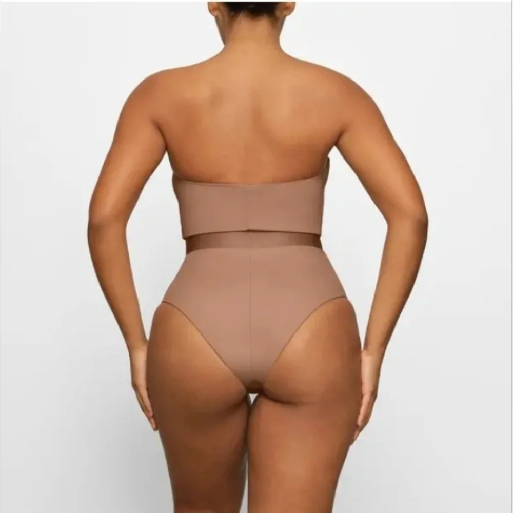 Skims sculpting one piece belted.